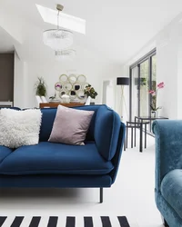 Living room with blue sofa design photo