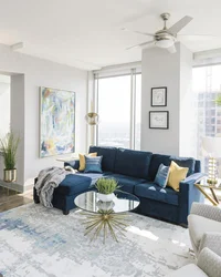 Living room with blue sofa design photo