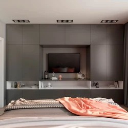 TV built into the closet in the bedroom photo