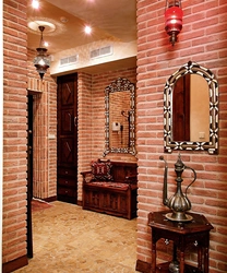 Hallway design with decorative brick and wallpaper