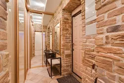 Hallway design with decorative brick and wallpaper