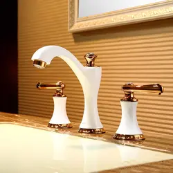 White faucets in the bathroom interior