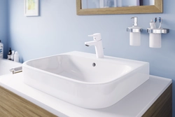 White faucets in the bathroom interior