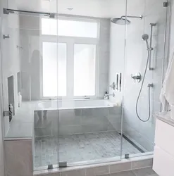 Bathtub and shower cabin in one photo