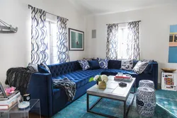 Living room with blue sofa and blue curtains photo