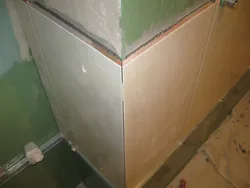 Photo of corner of bathtub tiles