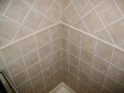 Photo of corner of bathtub tiles