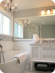 Bath interior with large mirror