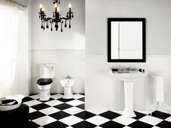 Bathtub made of white and black tiles in the bathroom photo