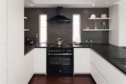 White kitchen black appliances in the interior