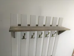 Wooden hangers for the hallway wall photos