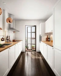Design of a narrow kitchen with a window on the entire wall