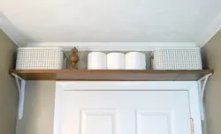 Photo of a bathroom cabinet up to the ceiling