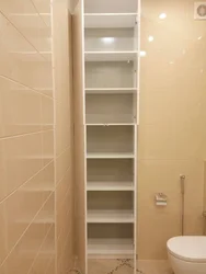 Photo of a bathroom cabinet up to the ceiling