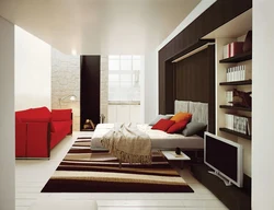 Living room design in an apartment with a bed
