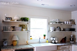 Wall shelves and cabinets in the kitchen interior