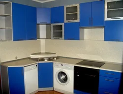 Kitchens with a washing machine under the countertop corner photo