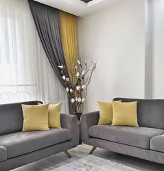 Living room design with gray sofa and curtains