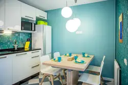 Kitchen with blue wallpaper design