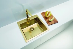 Golden sink in the kitchen interior