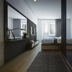 Interior of a narrow bedroom with one window