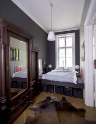 Interior of a narrow bedroom with one window