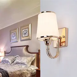 Wall sconce in the bedroom above the bed photo