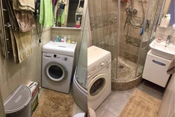 Photo Of A Bathroom With Shower And Washing Machine Photo