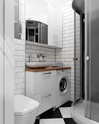 Photo of a bathroom with shower and washing machine photo