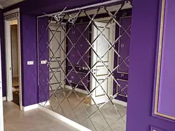 Diamond pattern mirror in the hallway interior