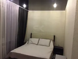 Bedroom interior with black glossy ceiling
