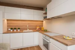 White set with a wooden countertop in the kitchen interior