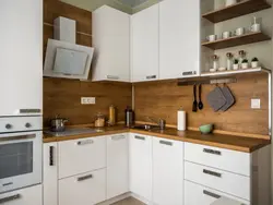 White set with a wooden countertop in the kitchen interior
