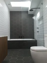 Gray tiles on the floor walls in the bathroom photo