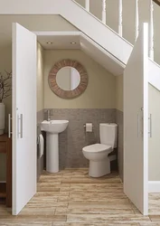 Bathroom design under the stairs photo