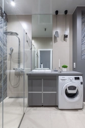 Photo Of A Bathroom With A Shower And A Washing Machine Without A Toilet