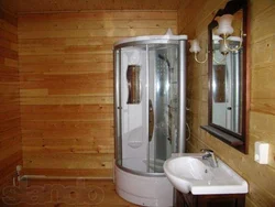 Interior of a bathroom with shower in a wooden house