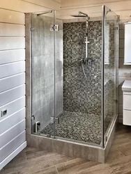 Interior of a bathroom with shower in a wooden house