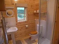 Interior Of A Bathroom With Shower In A Wooden House