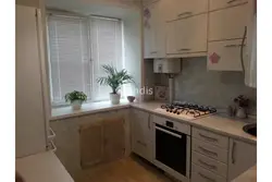 Kitchens in Khrushchev with a gas water heater and a refrigerator design 5