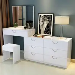 Chest of drawers with mirror in bedroom interior photo