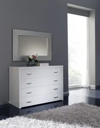 Chest of drawers with mirror in bedroom interior photo