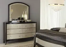 Chest of drawers with mirror in bedroom interior photo