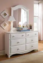 Chest of drawers with mirror in bedroom interior photo