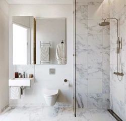 Bathroom design with marble tile shower