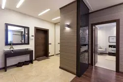 Dark Floor And Light Doors In The Interior Photo Of The Apartment