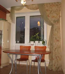 Window design in the kitchen with a loggia