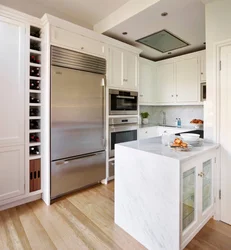 Refrigerator in the corner of the kitchen photo in the interior