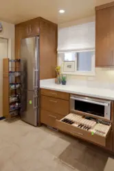 Refrigerator in the corner of the kitchen photo in the interior