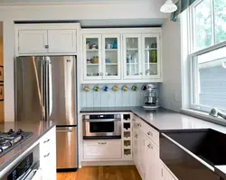 Refrigerator in the corner of the kitchen photo in the interior